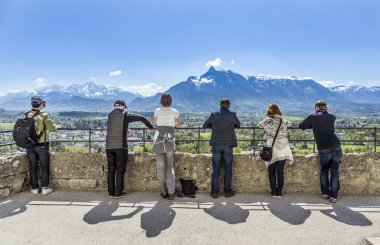 people watch the alps from castle Hohensalzburg in Salzburg