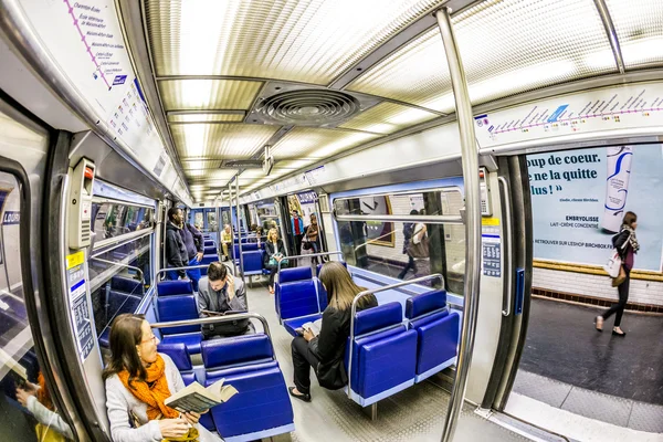 Tourists and locals on a subway train line 8 in Paris — Stock Photo, Image