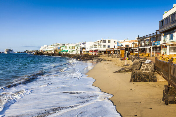 promenade of scenic Playa Blanca with seaside in the morning