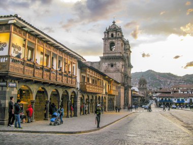 Plaza de armas in sunset with local people