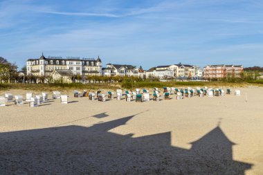 shadow of famous pier in Ahlbeck at the beach with beach chairs  clipart