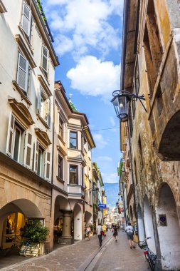 people at central shopping street in Meran, Italy 