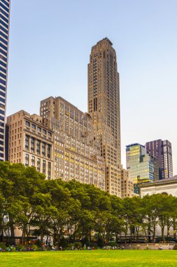 people enjoy sunset light at Bryant Park