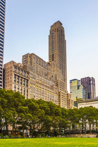 people enjoy sunset light at Bryant Park