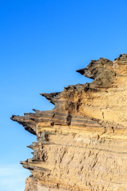 volcanic stone formation with blue sky at el Golfo 