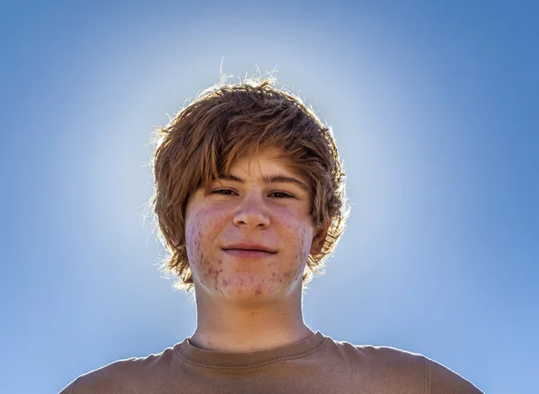 Teenage boy with red hair at the beach — Stock Photo, Image