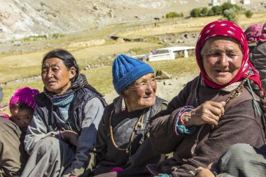  three elderly tibetan woman with her traditional clothes