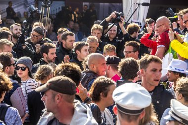 people demonstrate against the celebration of 25th day of German