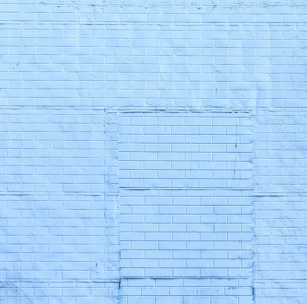 Старая кирпичная стена окрашенная в цвет — стоковое фото