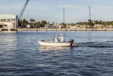 FORT LAUDERDALE, USA - AUG 20, 2014: man in boat for fishing by