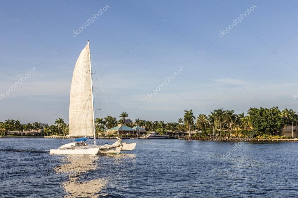 Sailing boat in the canal in Fort Lauderdale in late afternoon without logos