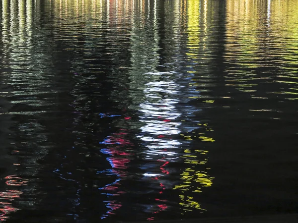 Reflection of colorful skyscrapers in the water — Stock Photo, Image