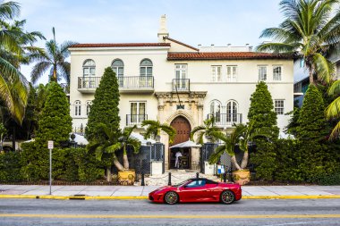 Ferrari in front of Versace mansion
