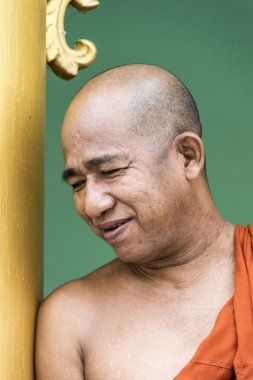 portrait of smiling monk in Shwedagon Pagoda