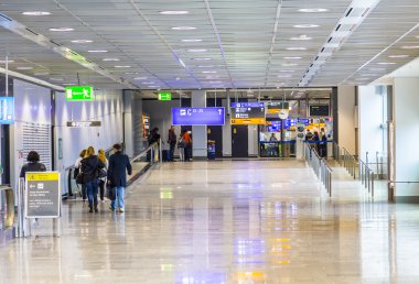 passengers at the departure hall in Frankfurt