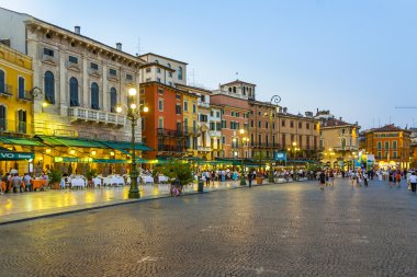 people enjoy walking at Piazza Bra