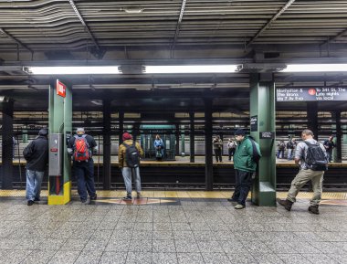 People wait at subway station Wall street in New York