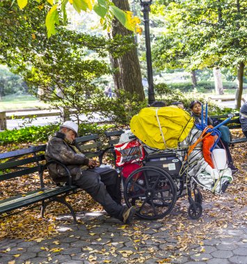 homeless man sleeping in central park   in Manhattan