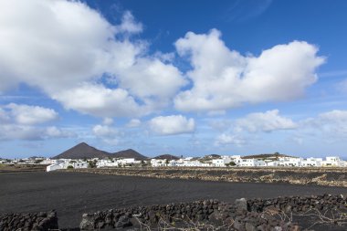 village of Tinajo with  volcanoes of Timanfaya national park