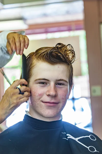 Young boy at the hairdresser — Stock Photo, Image