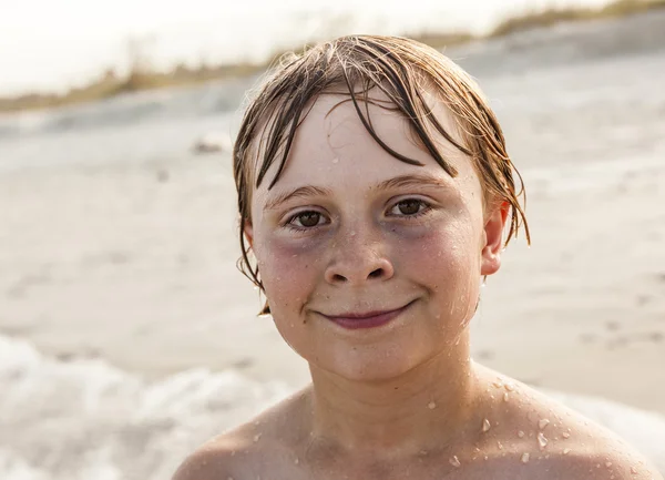 Boy relaxing on a bench — Stock Photo, Image