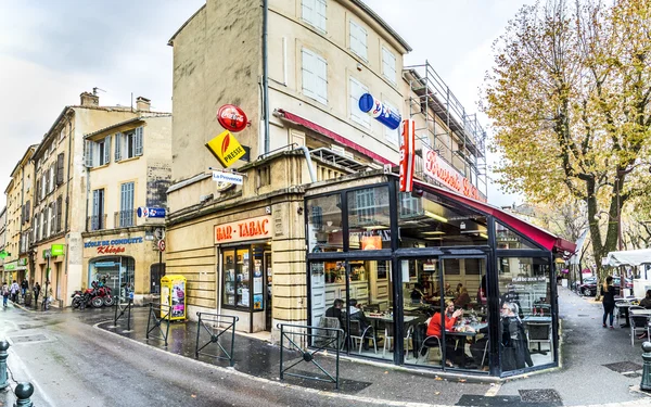 Street life with people sitting in a Brasserie in Aix en Provenc — стокове фото