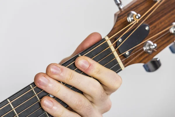detail of fingers and hand of guitar player