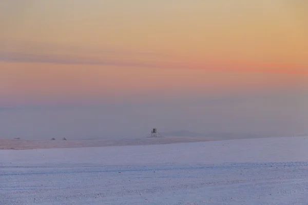 Paisaje de invierno con asiento alto y puesta de sol —  Fotos de Stock