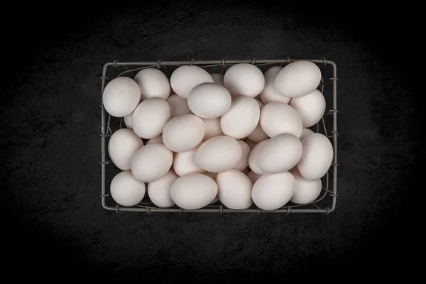 Small Wire Basket Assorted Fresh White Eggs Mottled Black Background — Stock Photo, Image