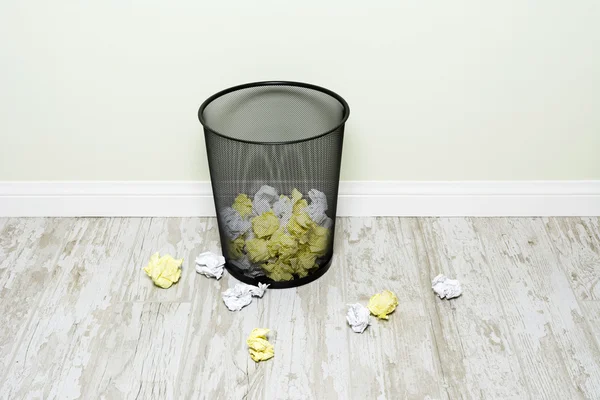 Crumpled paper in wastepaper basket — Stock Photo, Image