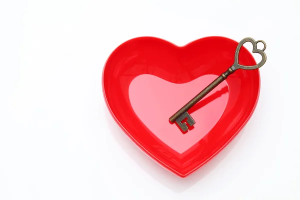 Antique rusty key and red heart — Stock Photo, Image