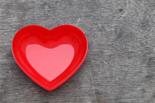 Red heart shape plate — Stock Photo, Image