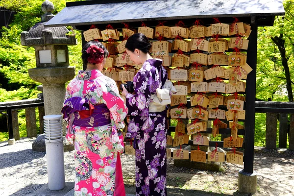 Japanese people write wishes in ema — Stock Photo, Image