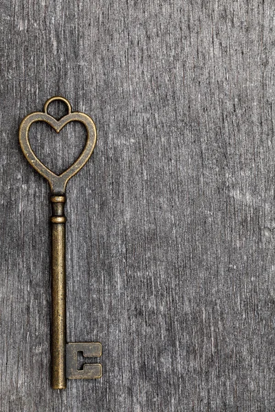 Heart shaped vintage key — Stock Photo, Image