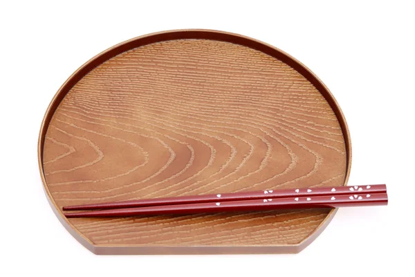 Stäbchen und Teller aus Holz — Stockfoto
