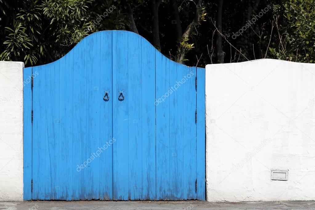 Old wooden blue gateway