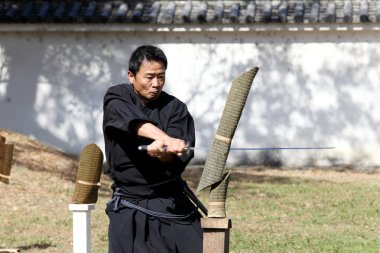 Samurai japanese clothing uniform with katana sword clipart