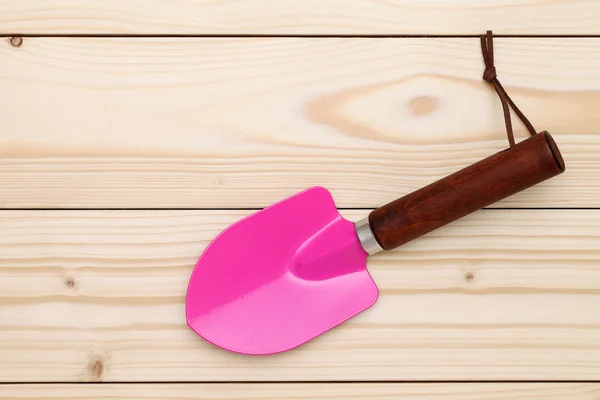 Garden shovel on table — Stock Photo, Image