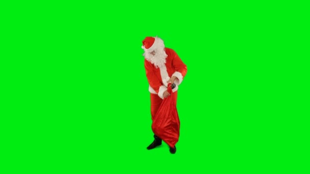 Święty Mikołaj Torbą Pełną Prezentów Pstrykając Palcami Aby Stworzyć Magię — Wideo stockowe