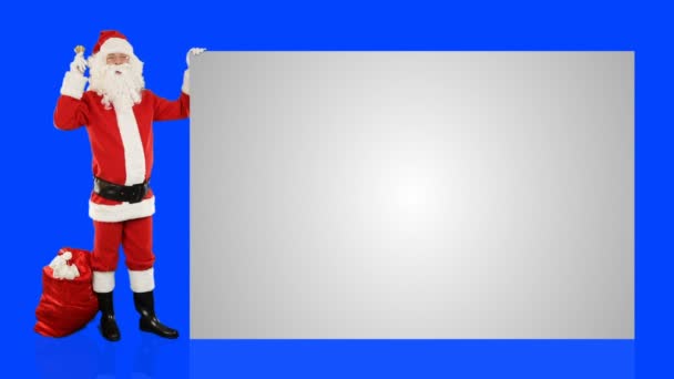 Santa Claus Shaking Bell Presenting White Sheet Blue Screen Chromakey — Stock Video