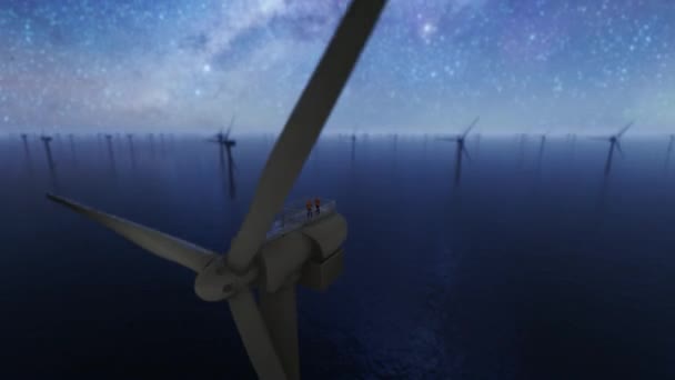 星空に対する洋上風力タービンの上の労働者 低ドローンビュー — ストック動画