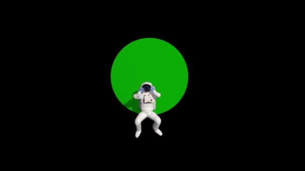 宇宙飛行士がテキストのためのスペースを持つ空白の緑の丸板の周りを回転 — ストック動画