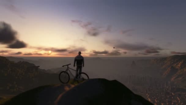 Cyclist on top of the mountain, timelapse sunset, fly over — Stock Video