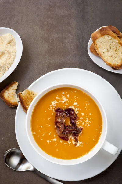 Pumpkin Soup with Pancetta Parmesan and Garlic Bread Top View — Stock Image Pumpkin Soup with Pancetta Parmesan and Garlic Bread Top View Royalty Free Stock Photos