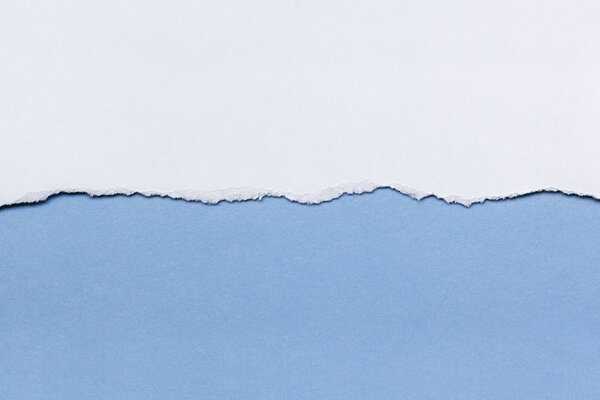 White Paper Tear over Blue