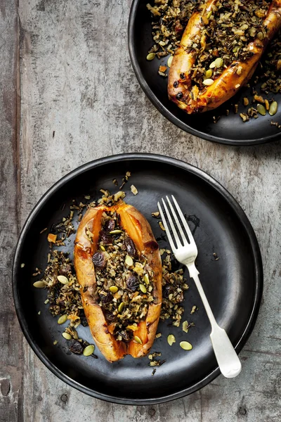 Baked Sweet Potatoes Stuffed With Wild Rice Seeds and Cranberrie — Stock Photo, Image