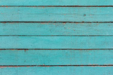 Ahşap zemin, eski ahşap duvar, maviye boyanmış, yarıklar ve çivilerle.