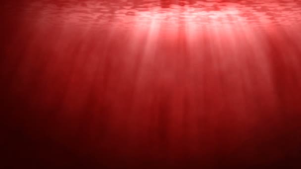 Rote Unterwasserszene mit Lichtstrahlen — Stockvideo