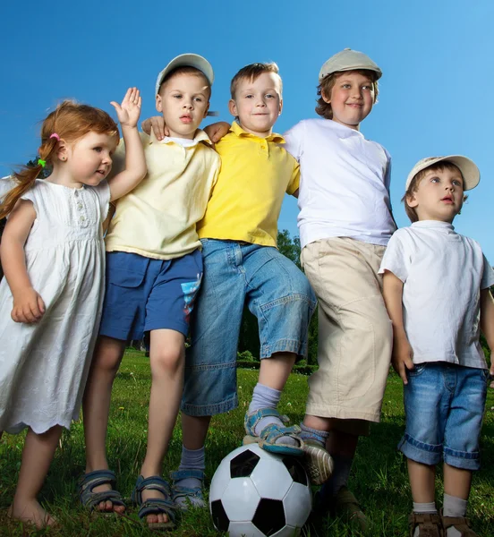 Happy boy and girl play in soccer — Stock Photo, Image