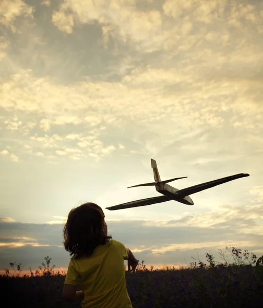 Children with airplan toy outdoors — Stock Photo, Image